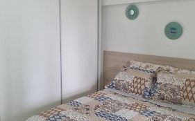 1/4 na praia de Armação